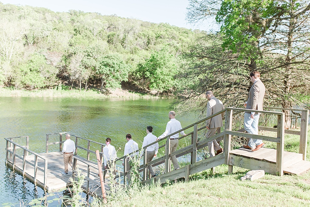 A minimalist ranch wedding in the Texas Hill Country featuring a canoe bridal party entrance and night portrait. 0023