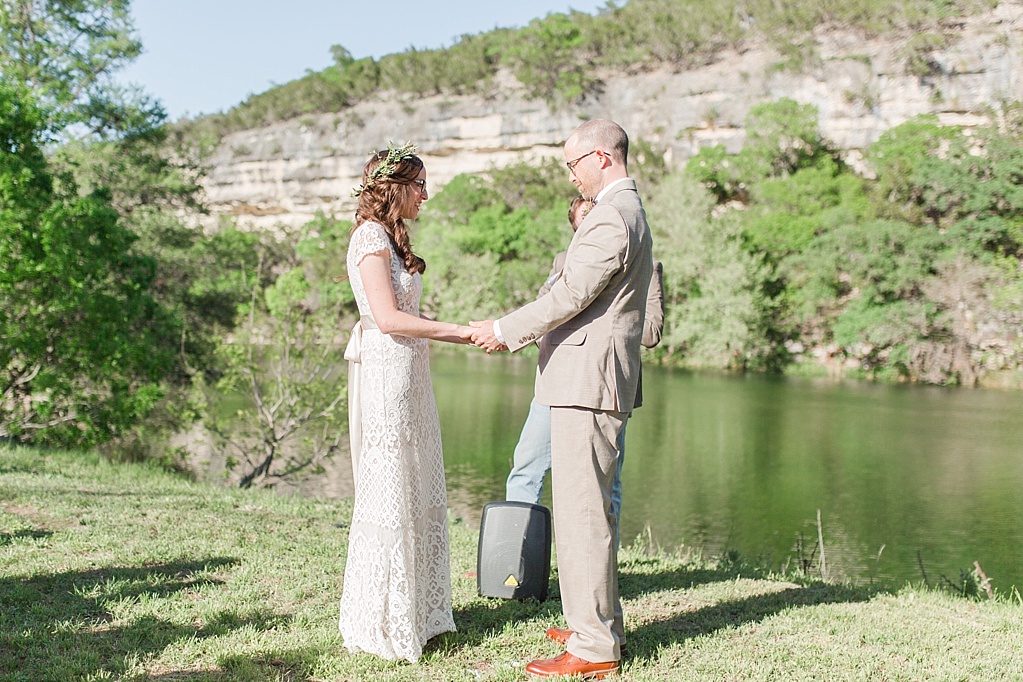 A minimalist ranch wedding in the Texas Hill Country featuring a canoe bridal party entrance and night portrait. 0032