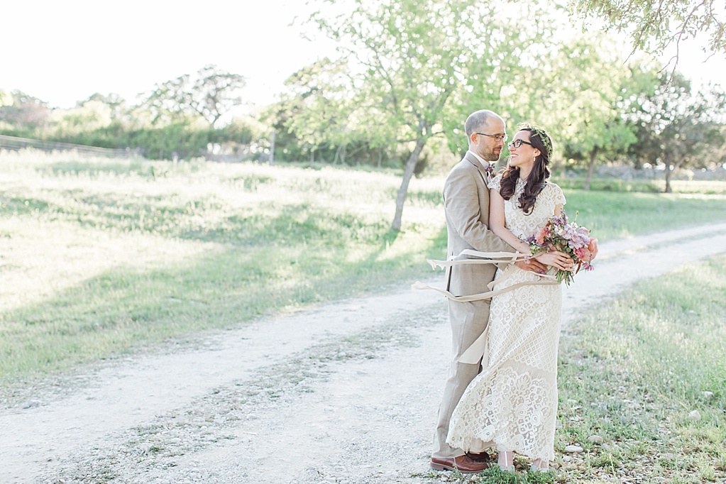 A minimalist ranch wedding in the Texas Hill Country featuring a canoe bridal party entrance and night portrait. 0041
