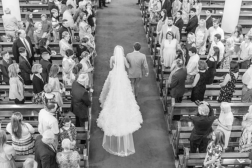 A classic summer wedding ceremony at St Marys Catholic Church in Fredericksburg Texas and wedding reception at The National Museum of the Pacific War Nimitz Museum 0035