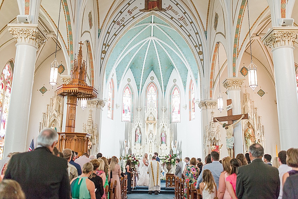A classic summer wedding ceremony at St Marys Catholic Church in Fredericksburg Texas and wedding reception at The National Museum of the Pacific War Nimitz Museum 0040