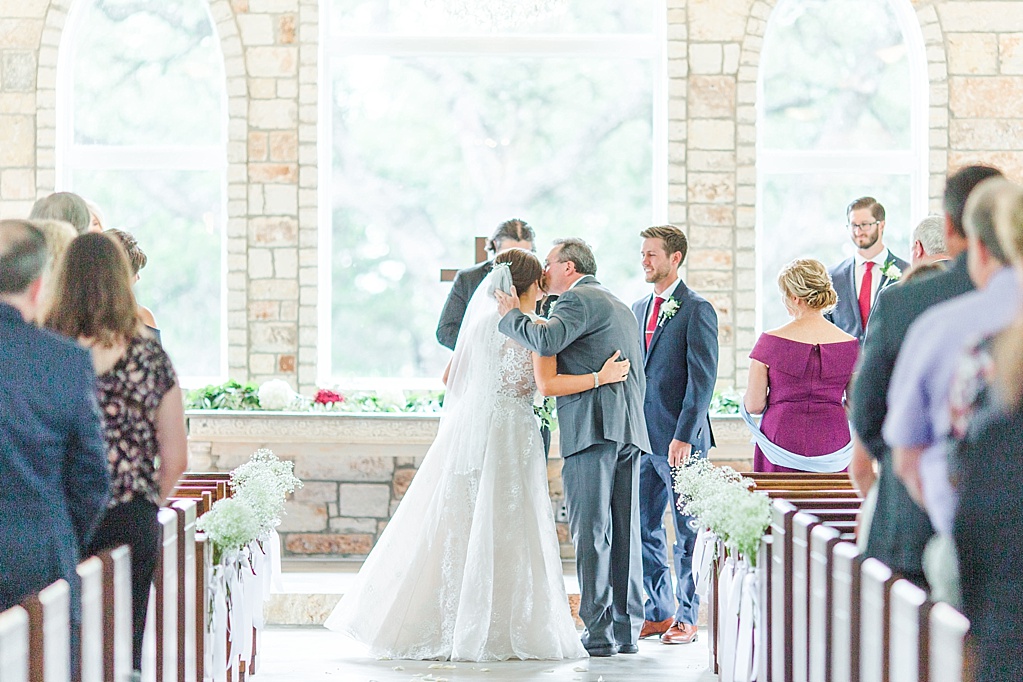 The Chandelier of Gruene New Braunfels Wedding photos featuring burgundy, navy, and grey wedding colors by Allison Jeffers Photography 0031