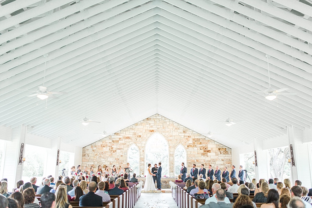 The Chandelier of Gruene New Braunfels Wedding photos featuring burgundy, navy, and grey wedding colors by Allison Jeffers Photography 0034