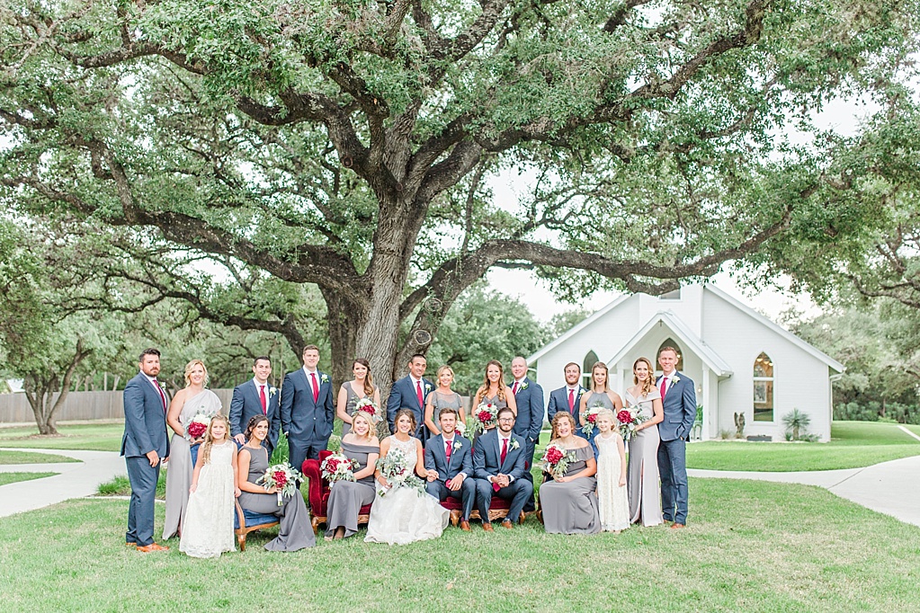 The Chandelier of Gruene New Braunfels Wedding photos featuring burgundy, navy, and grey wedding colors by Allison Jeffers Photography 0083