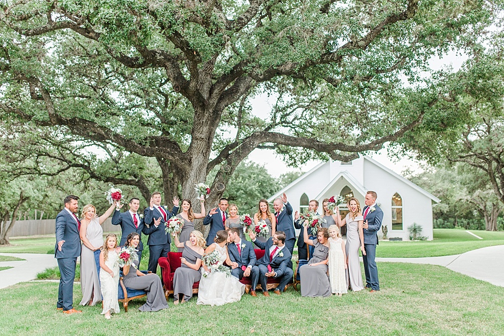 The Chandelier of Gruene New Braunfels Wedding photos featuring burgundy, navy, and grey wedding colors by Allison Jeffers Photography 0084