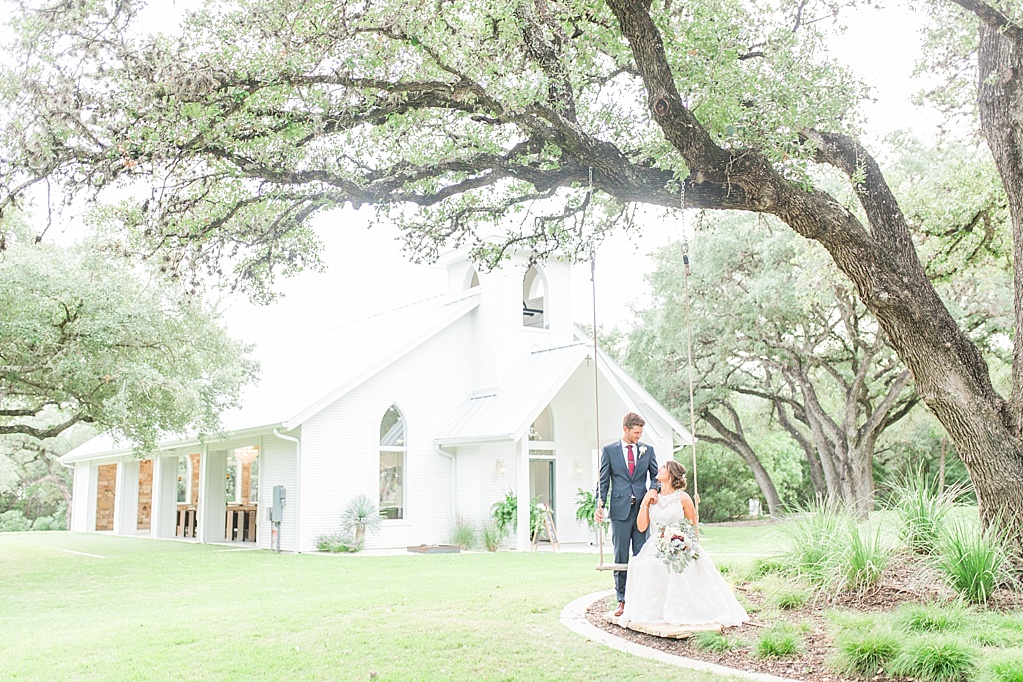 The Chandelier of Gruene New Braunfels Wedding photos featuring burgundy, navy, and grey wedding colors by Allison Jeffers Photography 0104