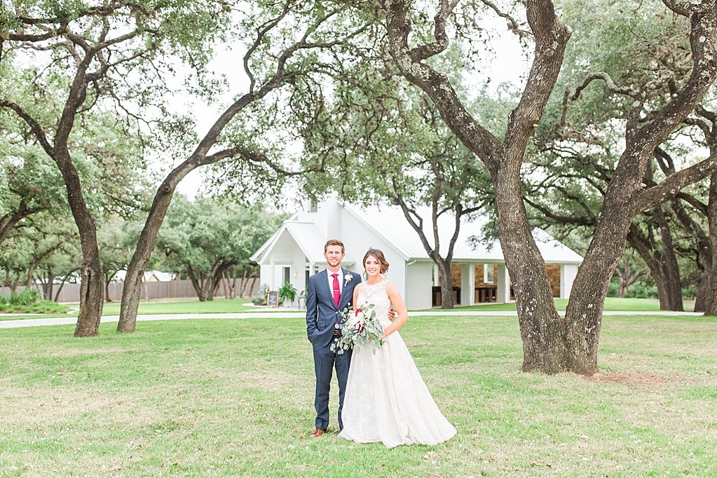 The Chandelier of Gruene New Braunfels Wedding photos featuring burgundy, navy, and grey wedding colors by Allison Jeffers Photography 0107