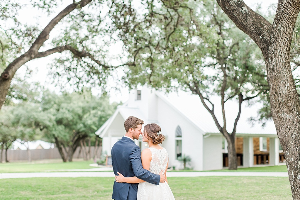 The Chandelier of Gruene New Braunfels Wedding photos featuring burgundy, navy, and grey wedding colors by Allison Jeffers Photography 0113