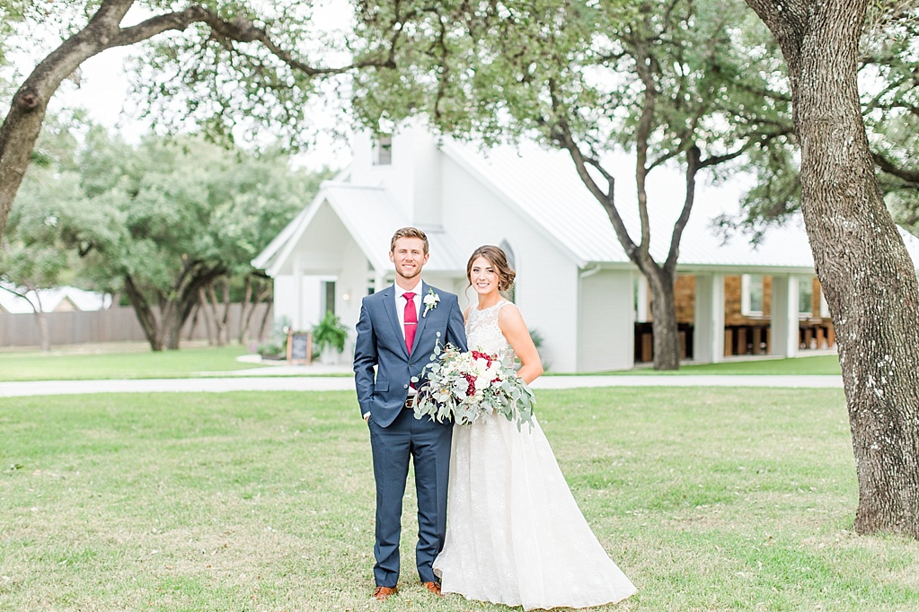 The Chandelier of Gruene New Braunfels Wedding photos featuring burgundy, navy, and grey wedding colors by Allison Jeffers Photography 0116