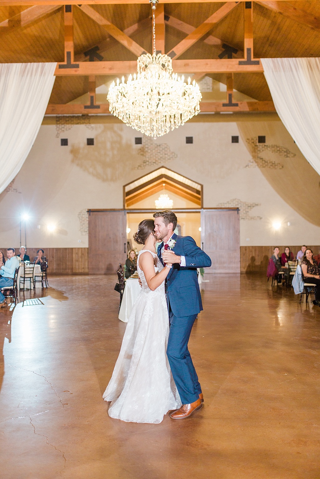 The Chandelier of Gruene New Braunfels Wedding photos featuring burgundy, navy, and grey wedding colors by Allison Jeffers Photography 0140
