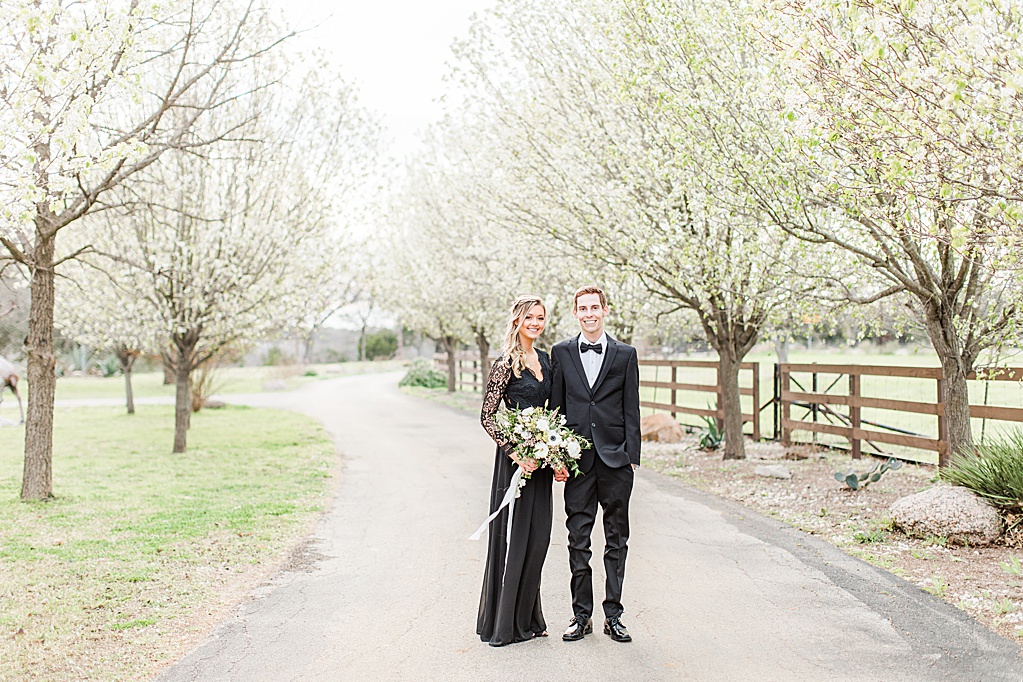 King River Ranch Wedding Venue in Johnson City Engagement Photos in the white Pear blossoms by Allison Jeffers Wedding Photography 0010
