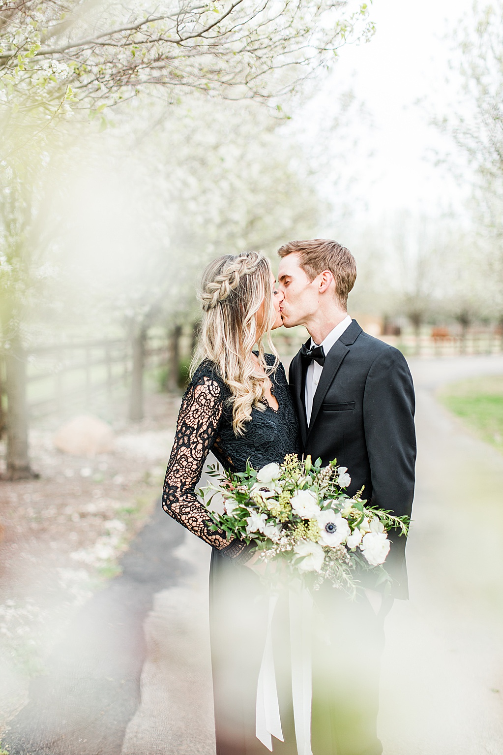 King River Ranch Wedding Venue in Johnson City Engagement Photos in the white Pear blossoms by Allison Jeffers Wedding Photography 0013