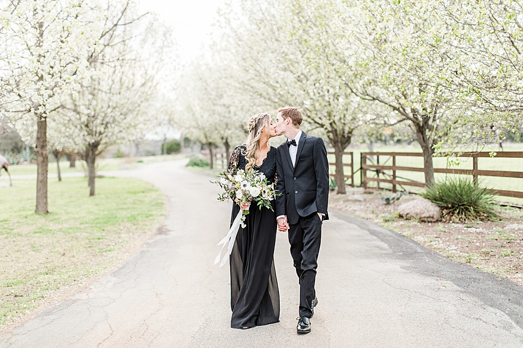King River Ranch Wedding Venue in Johnson City Engagement Photos in the white Pear blossoms by Allison Jeffers Wedding Photography 0017