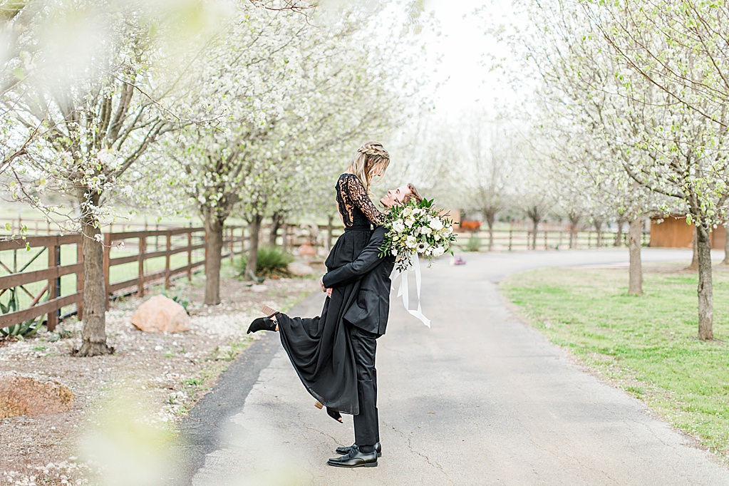King River Ranch Wedding Venue in Johnson City Engagement Photos in the white Pear blossoms by Allison Jeffers Wedding Photography 0022