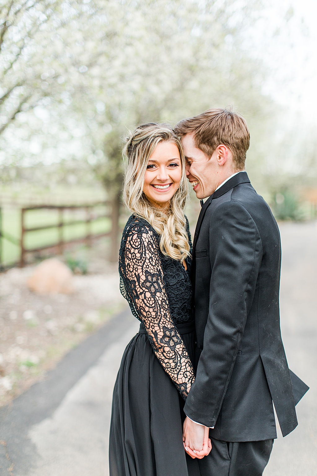 King River Ranch Wedding Venue in Johnson City Engagement Photos in the white Pear blossoms by Allison Jeffers Wedding Photography 0024