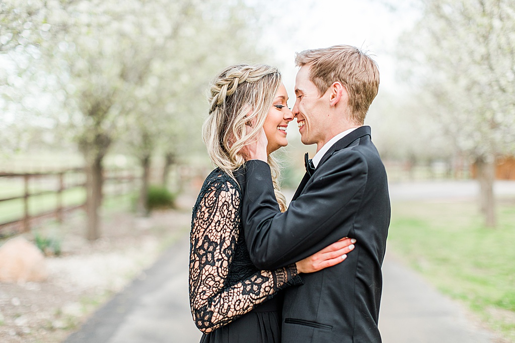 King River Ranch Wedding Venue in Johnson City Engagement Photos in the white Pear blossoms by Allison Jeffers Wedding Photography 0025