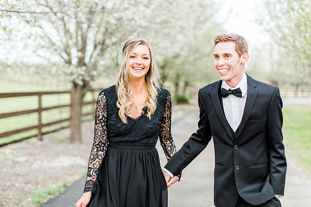 King River Ranch Wedding Venue in Johnson City Engagement Photos in the white Pear blossoms by Allison Jeffers Wedding Photography 0030