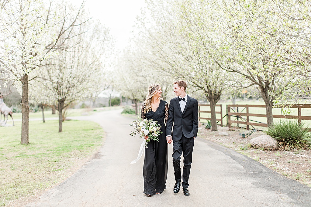 King River Ranch Wedding Venue in Johnson City Engagement Photos in the white Pear blossoms by Allison Jeffers Wedding Photography 0033