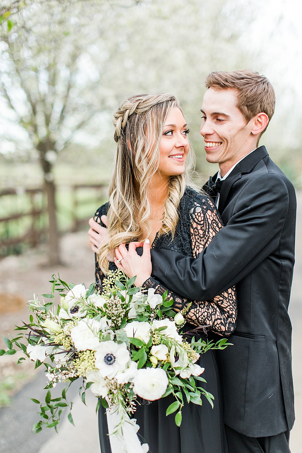 King River Ranch Wedding Venue in Johnson City Engagement Photos in the white Pear blossoms by Allison Jeffers Wedding Photography 0036
