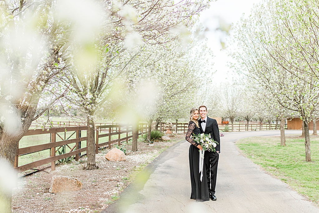 King River Ranch Wedding Venue in Johnson City Engagement Photos in the white Pear blossoms by Allison Jeffers Wedding Photography 0045