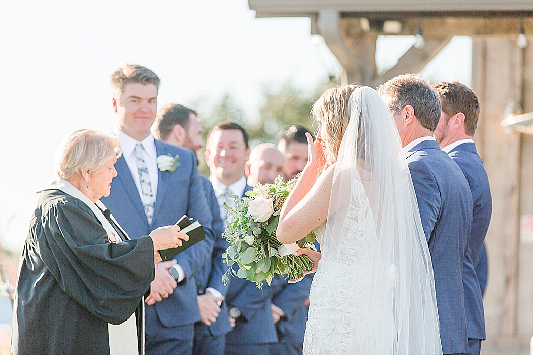 A greenery and dusty blue wedding at Sunset Ranch Event Center in Fredericksburg Texas by Allison Jeffers Associate Photographer 0141