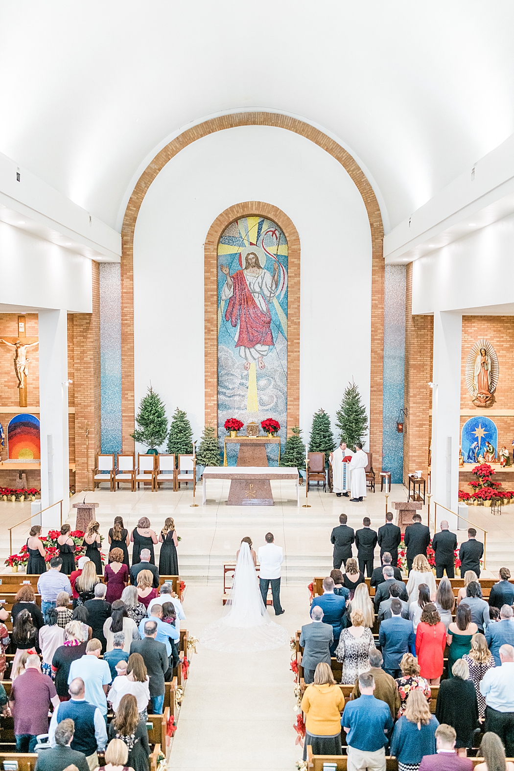 Chandelier of gruene reception and St. John the Evangelist Catholic Church in San Marcos, Tx wedding ceremony 0042