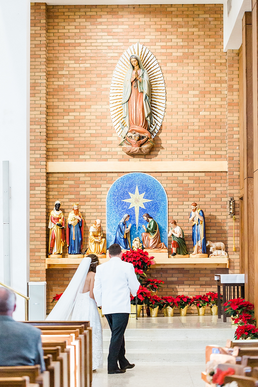 Chandelier of gruene reception and St. John the Evangelist Catholic Church in San Marcos, Tx wedding ceremony 0051