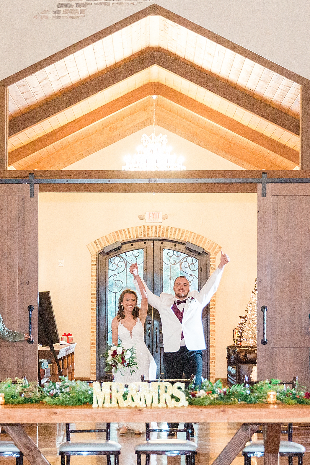 Chandelier of gruene reception and St. John the Evangelist Catholic Church in San Marcos, Tx wedding ceremony 0104