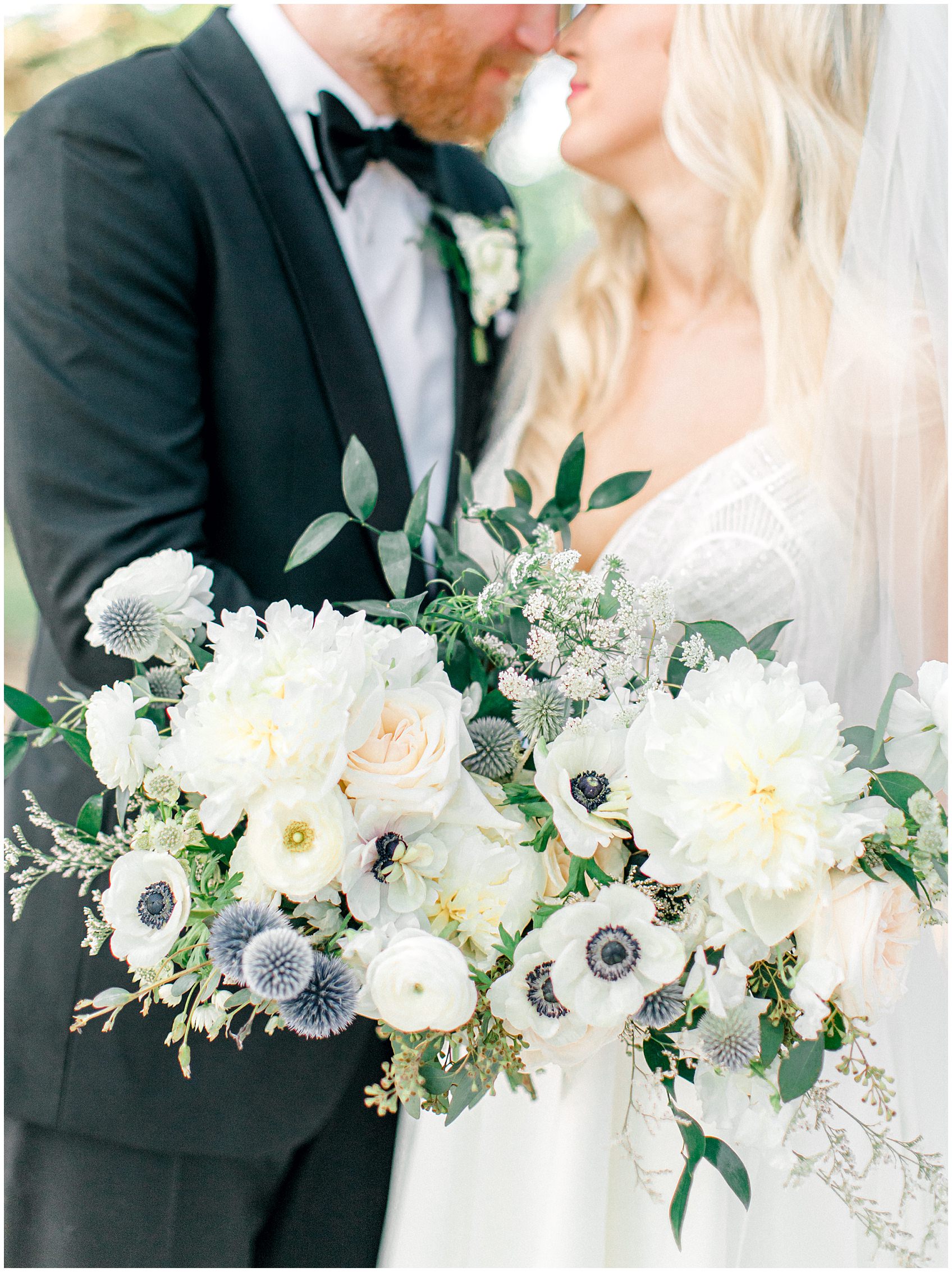 camp lucy wedding by Allison Jeffers Photography with white and blue black eyed anemone bouquet 0077